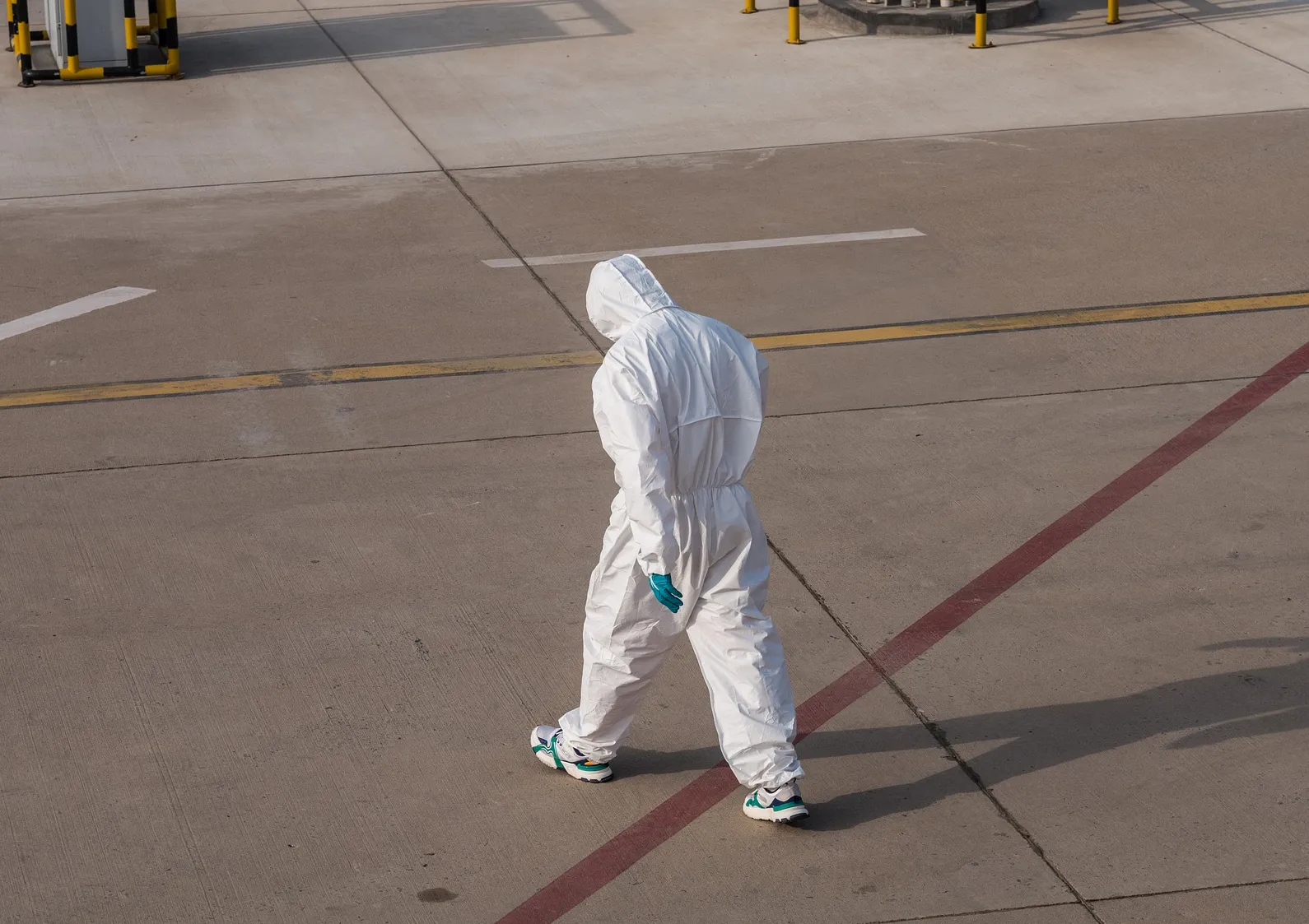 COVID PPE Worker Walking Away