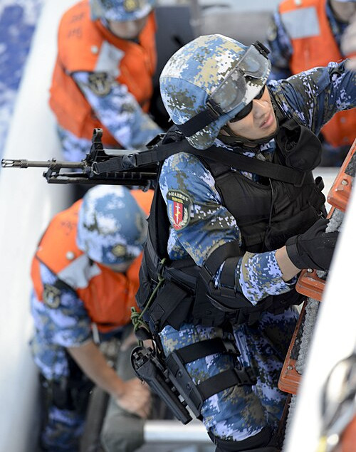 China - PLAN - A PLAN marine with a boarding team assigned to the guided missile destroyer Haikou during a maritime operations exercise in RIMPAC 2014.