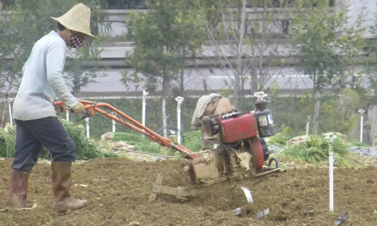 China Farming Agriculture Ploughing with a motor plough, Yuxi, Yunnan